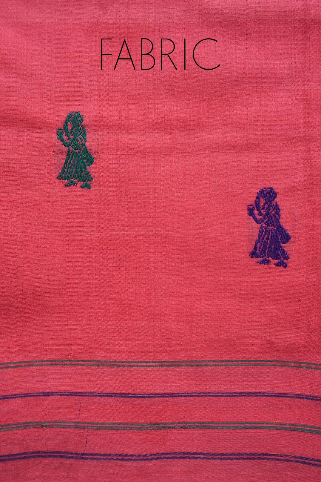 Peach fabric with blue patterns and text, featuring a design of a person and floral elements.