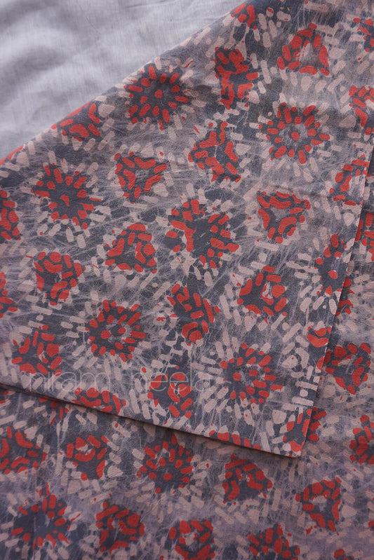 Grey and orange Batik geometric print cotton fabric | Niram Neela