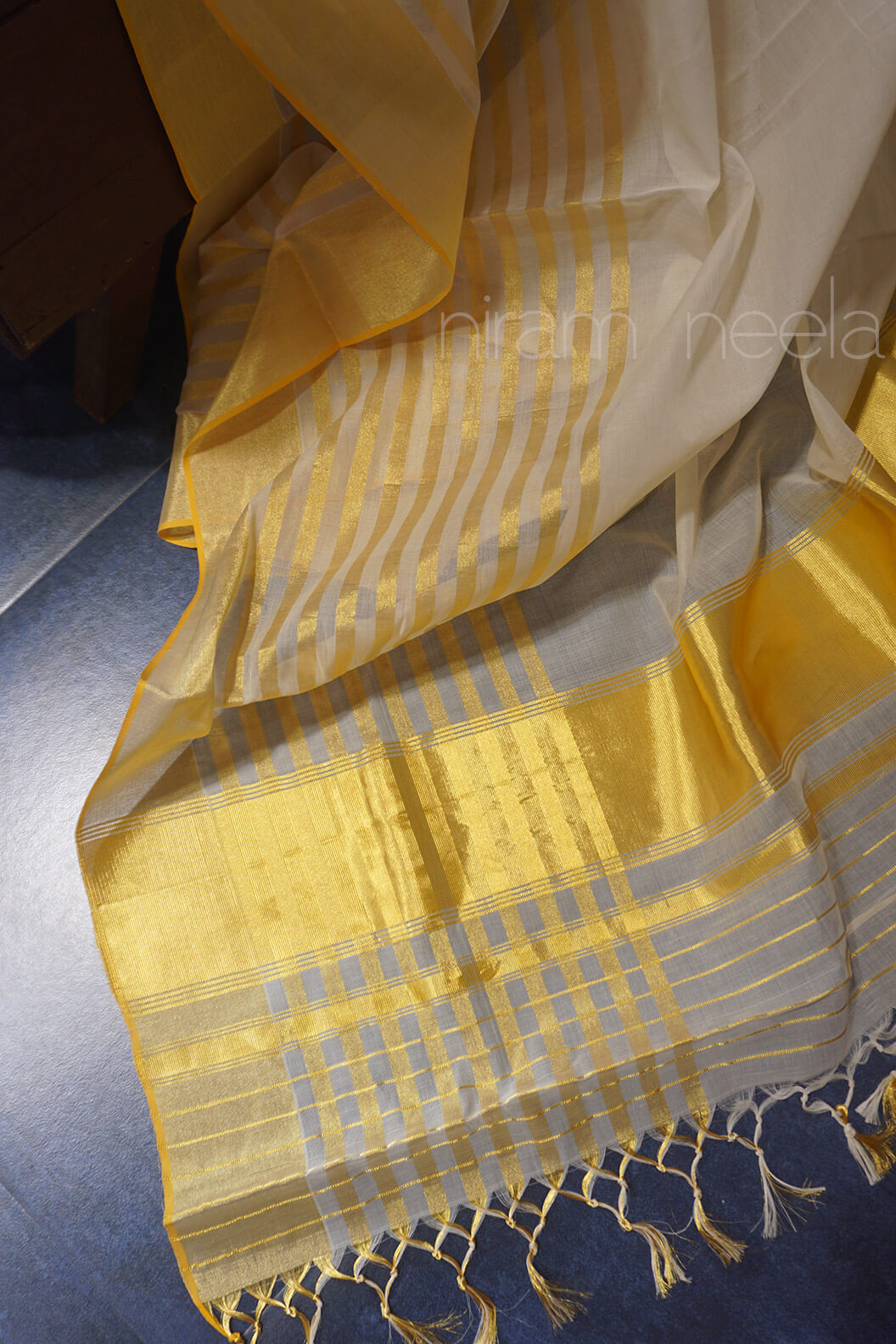 Ivory and golden striped Kasavu saree | Niram Neela