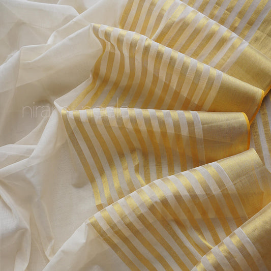 Close-up of yellow and white striped Kasavu fabric with niram neela branding.