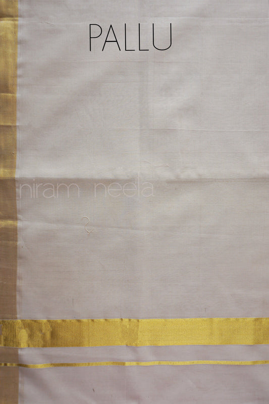 A close-up of off-white saree with a metallic gold border, labeled 'PALLU' at the top.