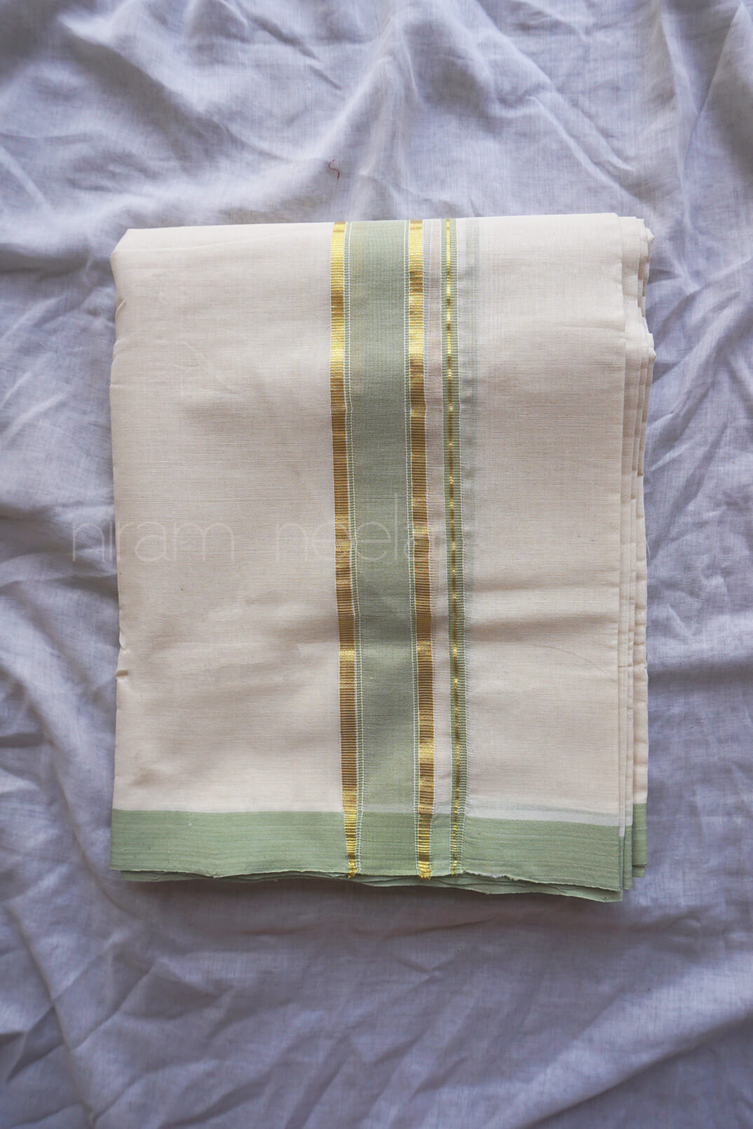 Ivory and pista green kasavu double mundu - Niram Neela