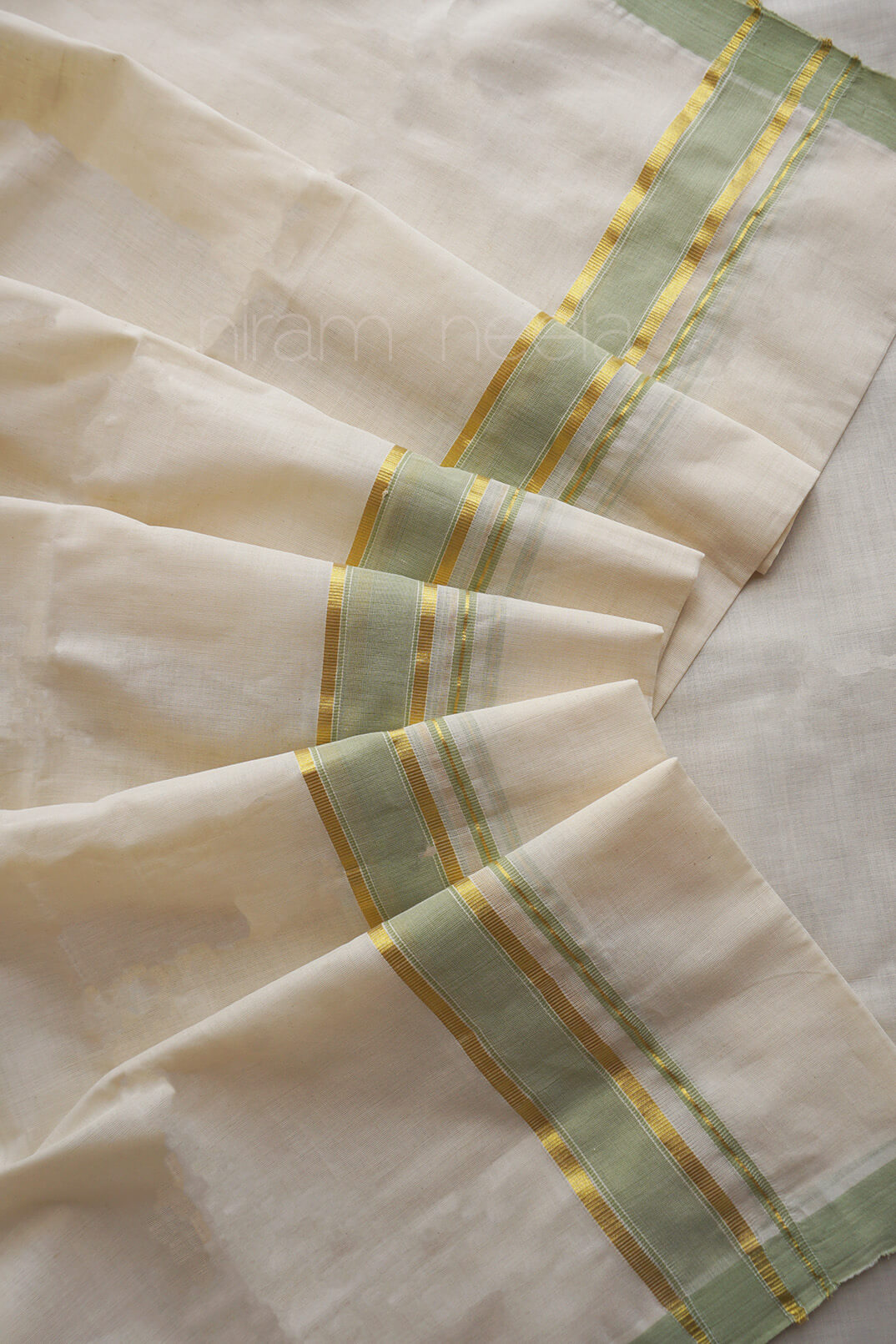 Ivory and pista green kasavu double mundu - Niram Neela