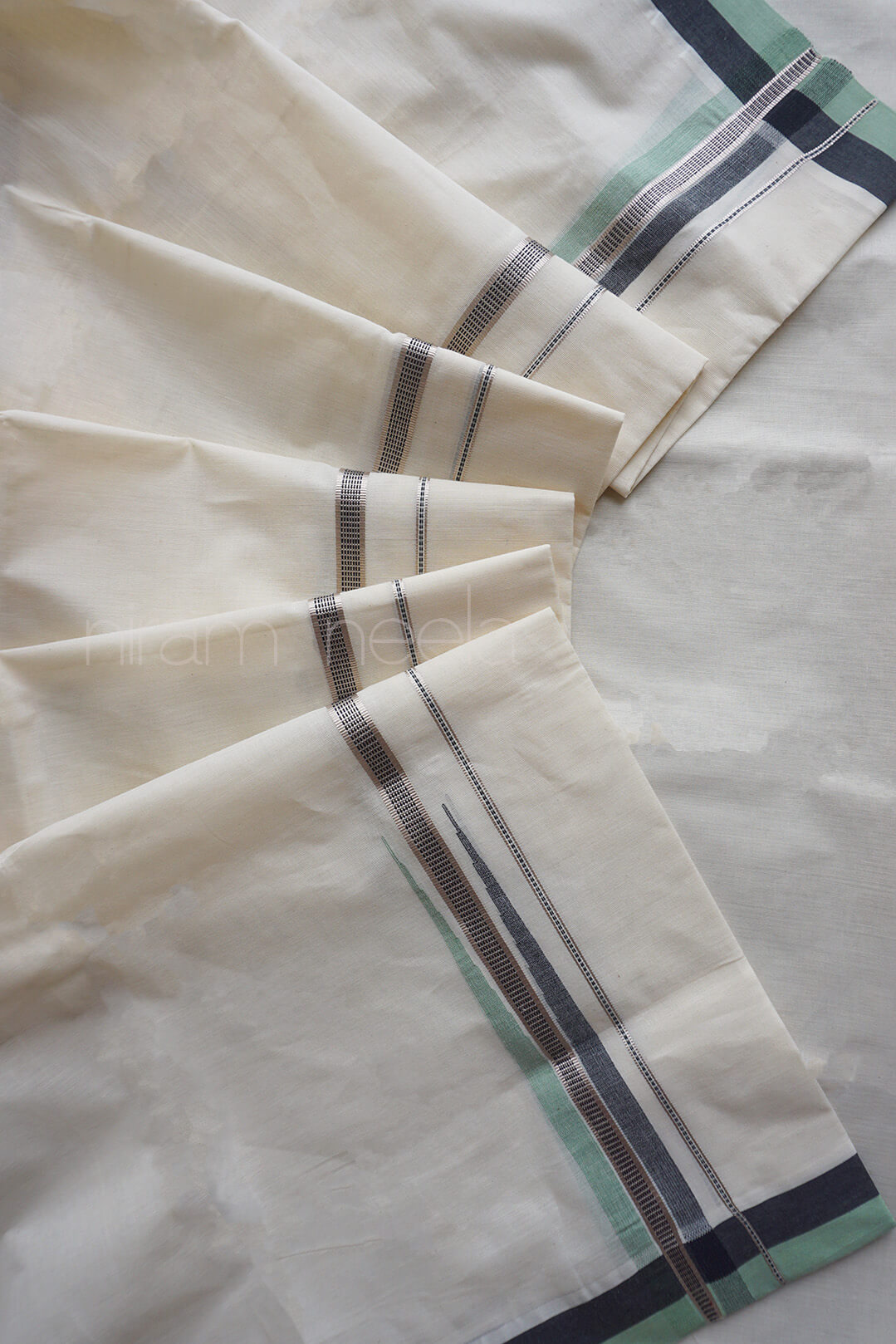 Ivory, green and silver chutti double mundu | Niram Neela