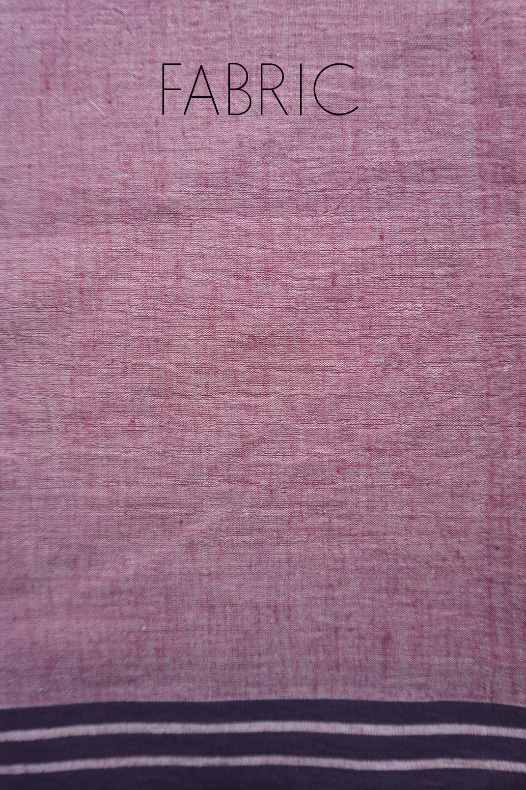 A close-up of a pale aubergine fabric sample with the word 'FABRIC' printed at the top and a black striped border along the bottom edge.