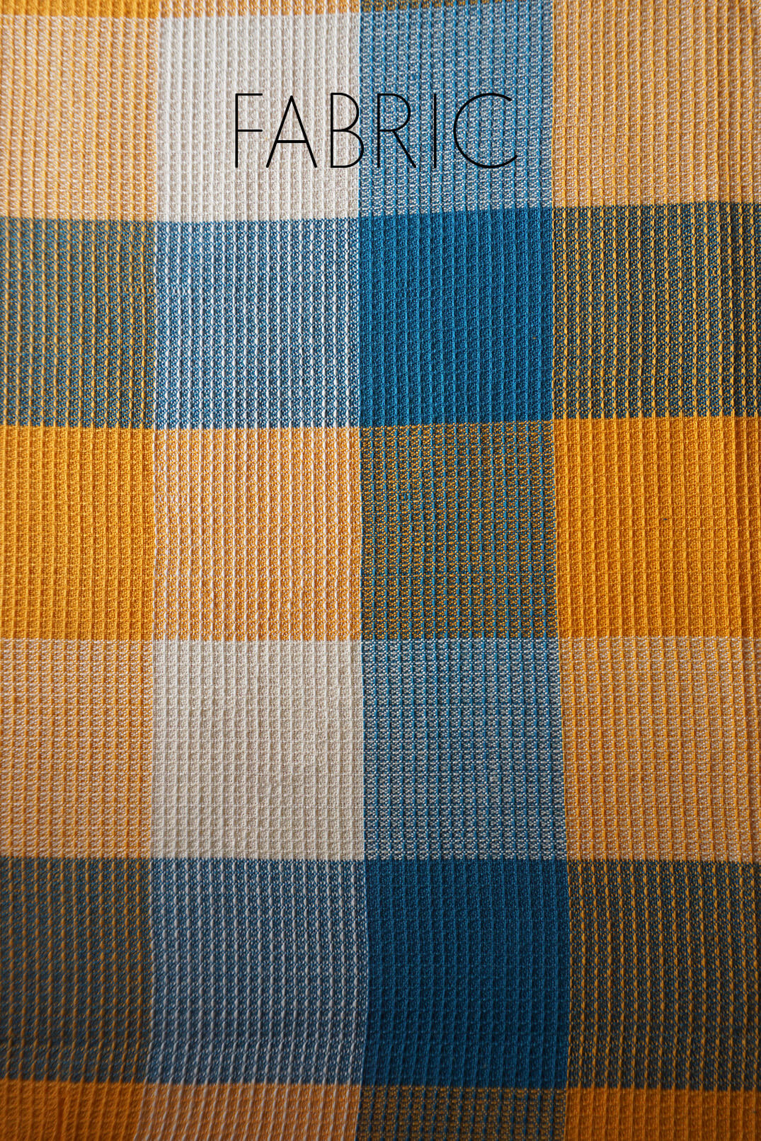 Checkered bedsheet with a pattern of blue, orange, and white squares | Home linen by Niram neela