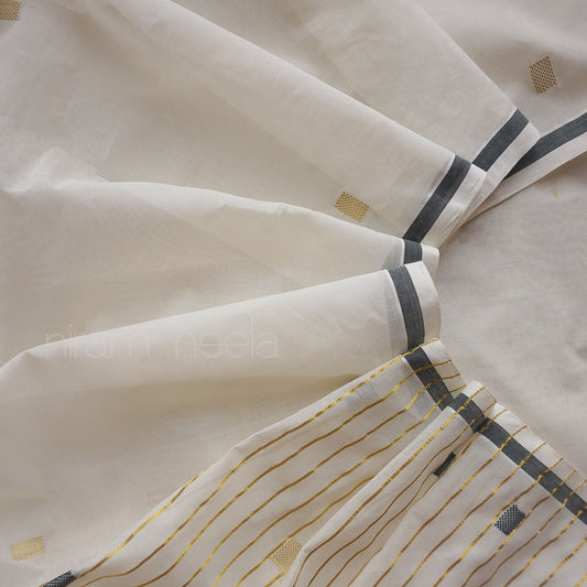 A close-up of saree in warm off-white/cream, with dark green stripes and thin gold pinstripes near the lower right corner. No person, animal, or real environment is visible, so this is Product/Packaging rather than Lifestyle.