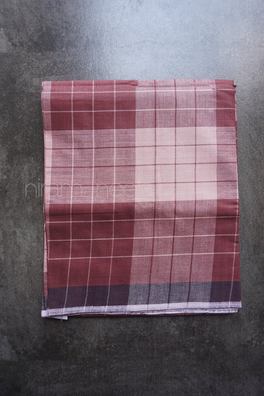 Plaid fabric with red and beige pattern on a gray background