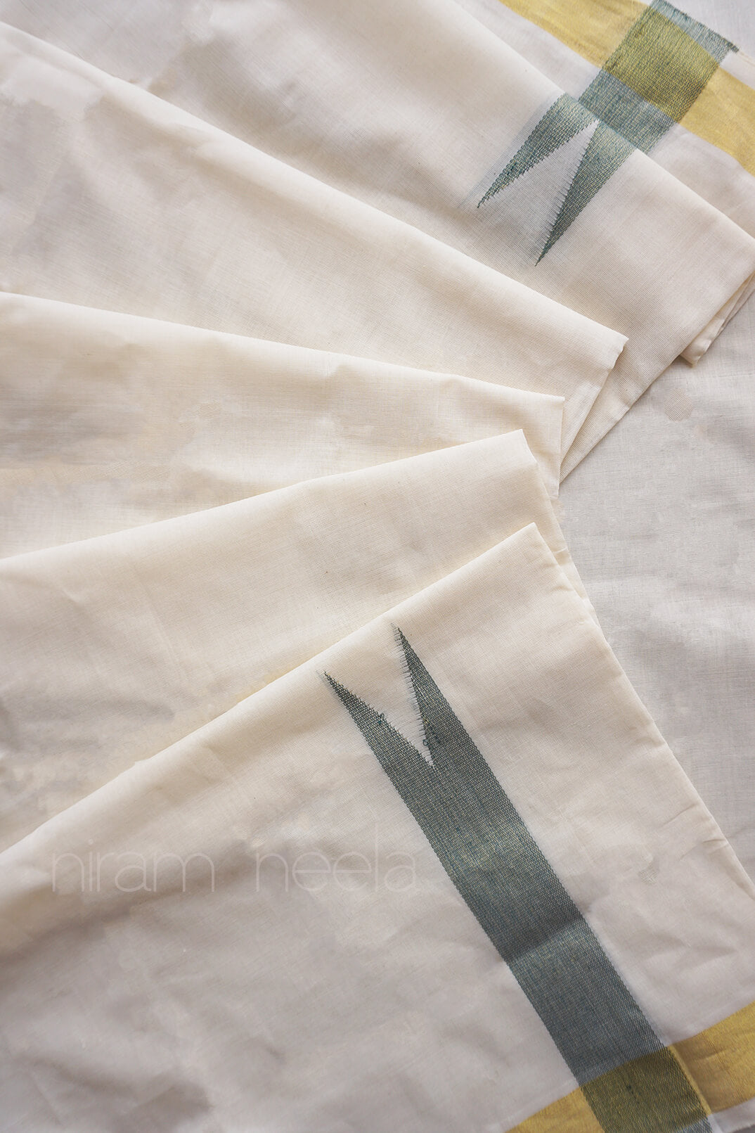 Ivory and green chutti double mundu for men from Niram Neela