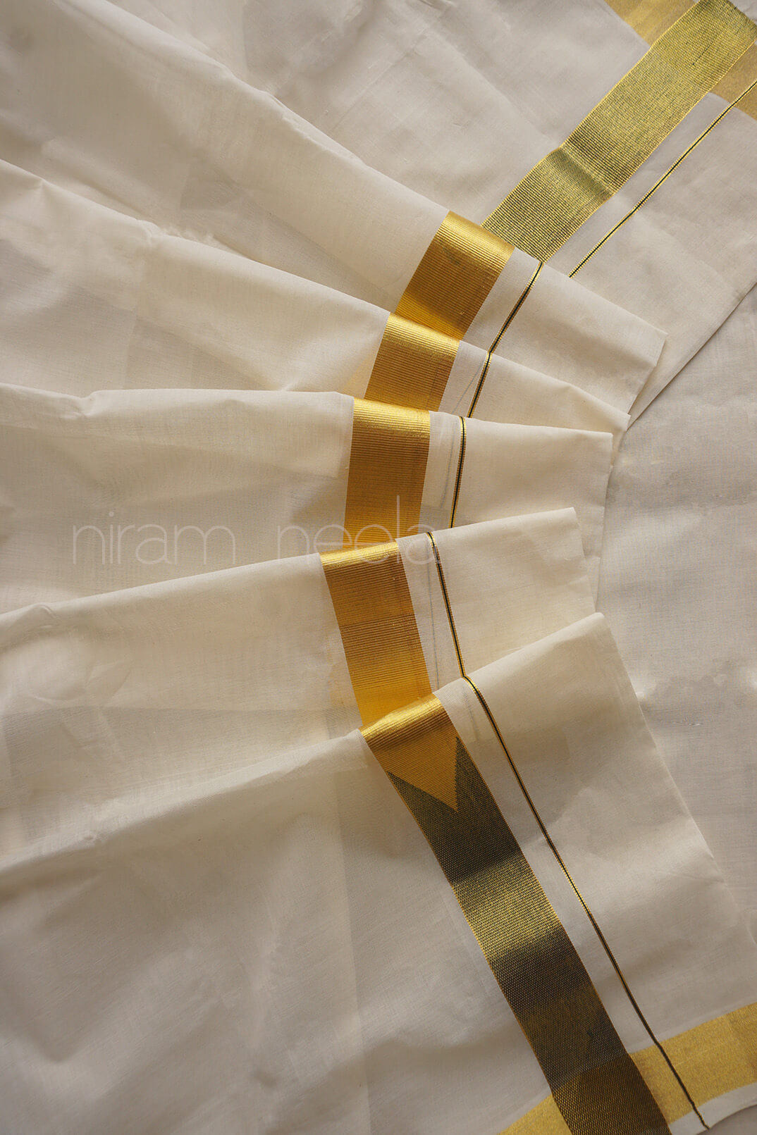 Ivory, green and gold chutti double mundu | Kasavu by Niram Neela