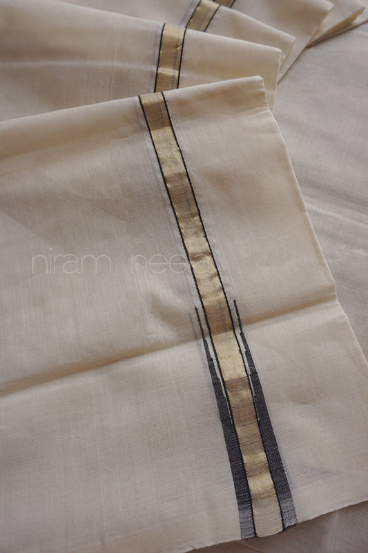 A close-up of a folded cream-colored dhoti in cotton, featuring a central vertical stripe pattern with a metallic gold center and thin black side borders.