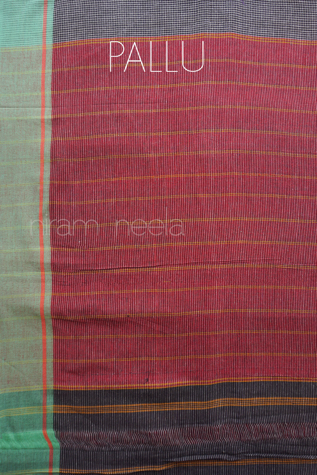 Textured fabric with 'Pallu' and 'niram neela' branding on a multicolored background