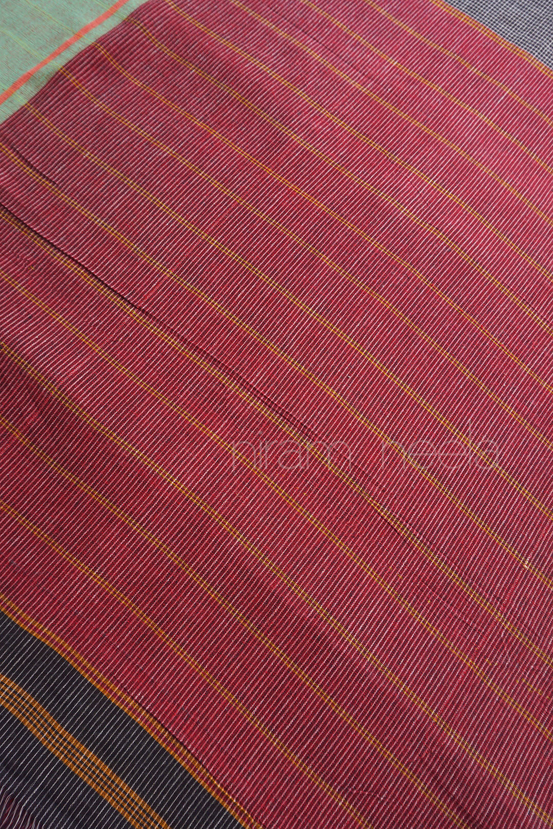 Close-up of a fabric with red and black checkered pattern