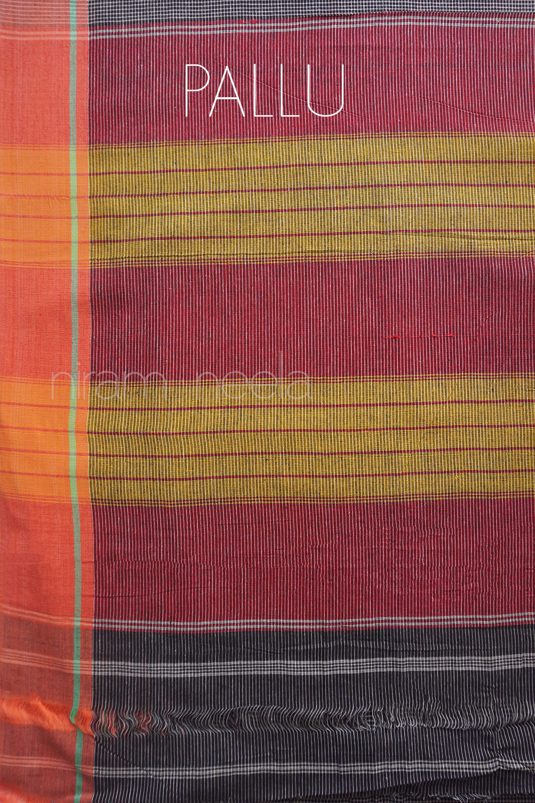 Striped fabric with 'PALLU' text on a close-up of a colorful textile.