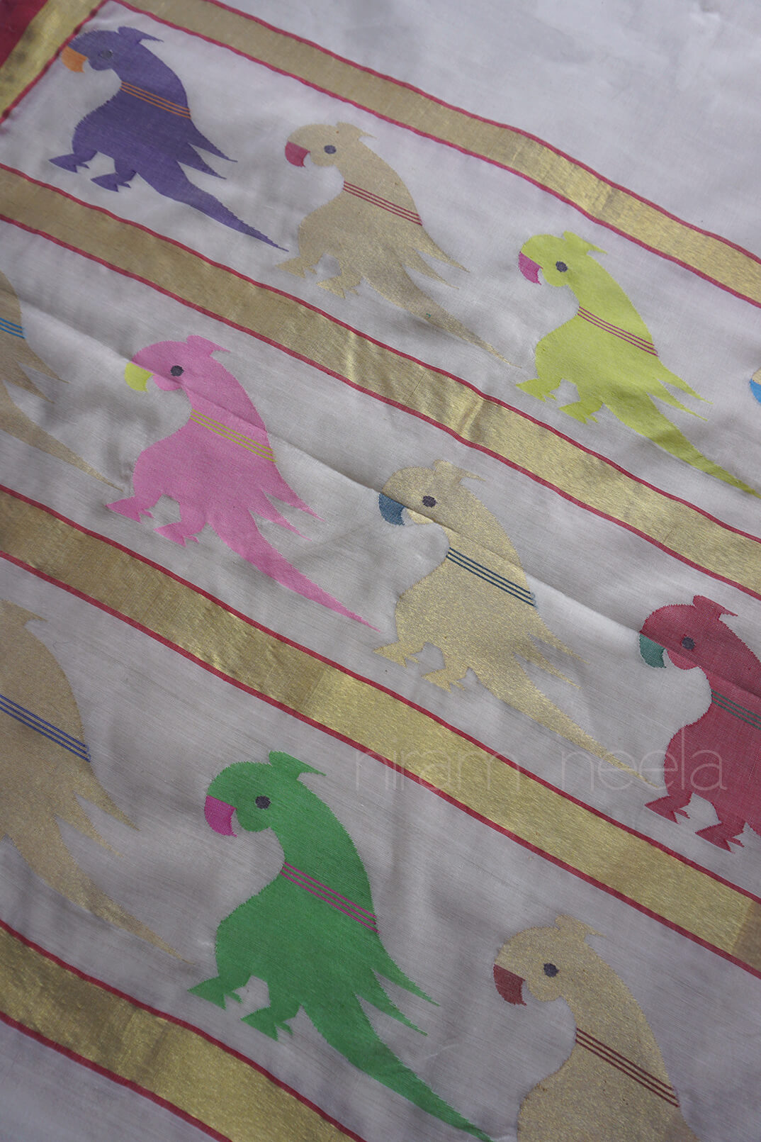 Ivory and red handloom Venkatagiri jamdani cotton parrot saree from Niram Neela